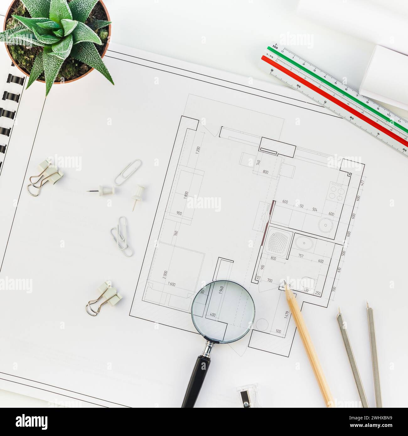 Interior designer table workplace with house plan Stock Photo - Alamy