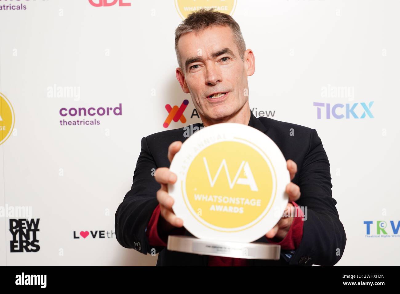 Rufus Norris with the award for services to theatre at the WhatsOnStage