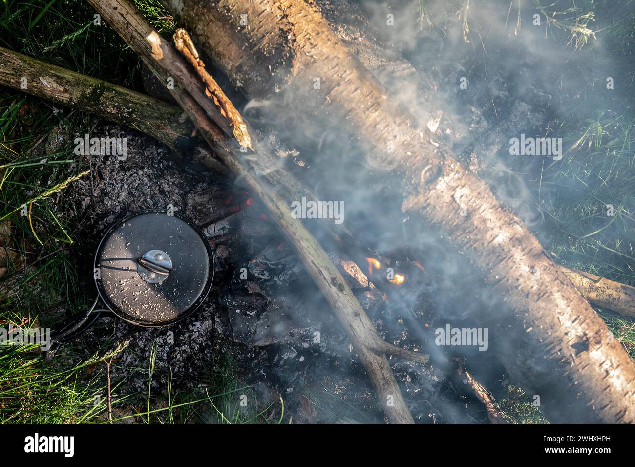 Camp cooking on fire Stock Photo
