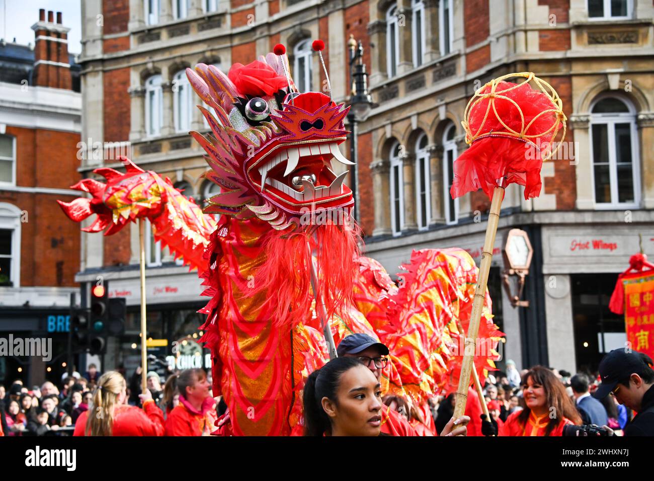 Charing Cross road, London, UK. 11th Feb, 2024. The Chinese New Year parade has many dragons representing the Year of the Dragon. Thousands of people attended the Chinese celebration in London, which saw paraders dressed in traditional Chinese costumes, Chinese style floats, lion dances, and dragon dances performed. The 2024 Lunar New Year is the Year of the Dragon. The Chinese Community in London, UK organized a parade along Charing Cross Road in London Chinatown and performed in Trafalgar Square. Credit: See Li/Picture Capital/Alamy Live News Stock Photo
