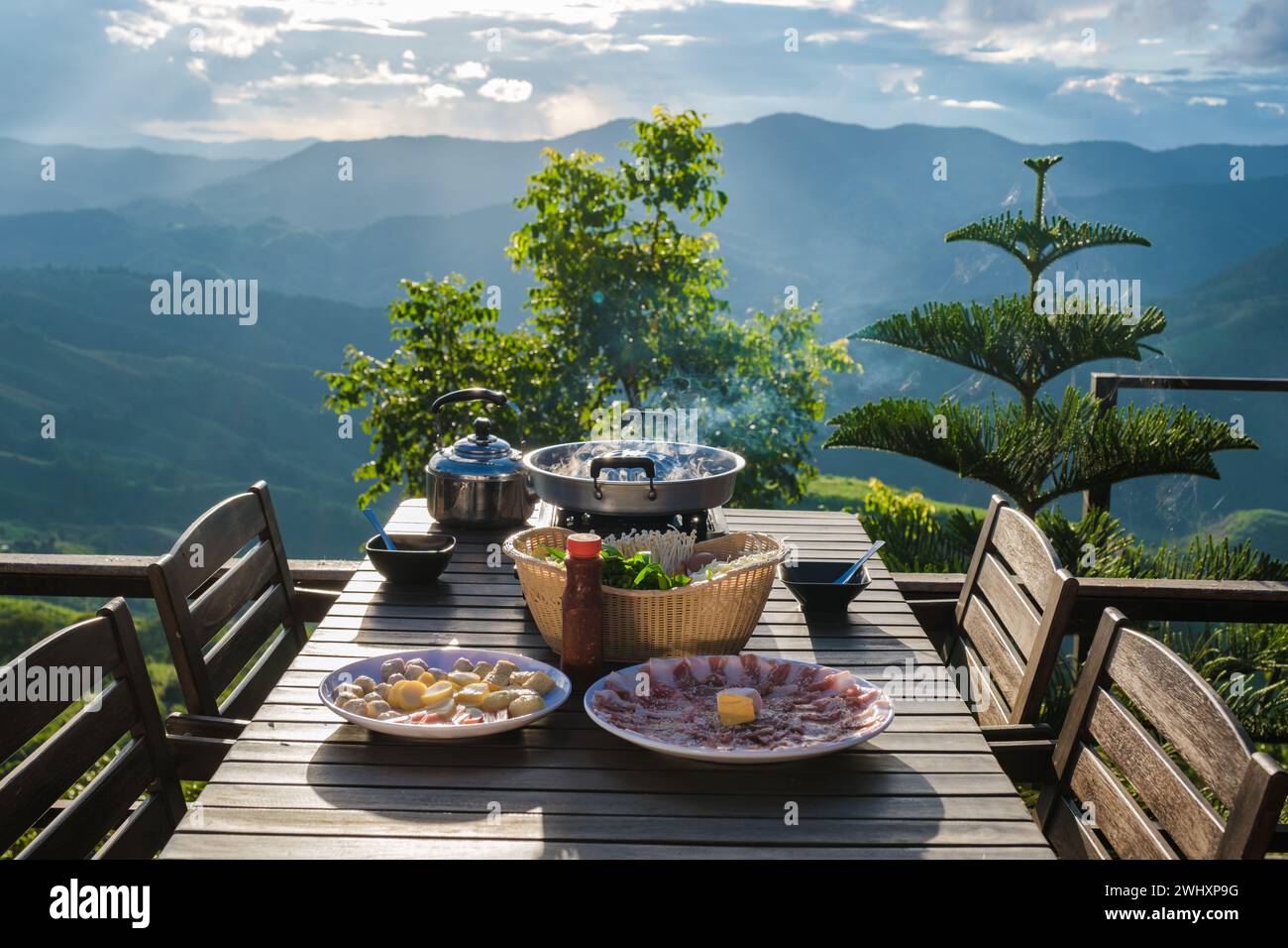 Dinner with a Thai BBQ at sunset in the mountains of Thailand Stock Photo