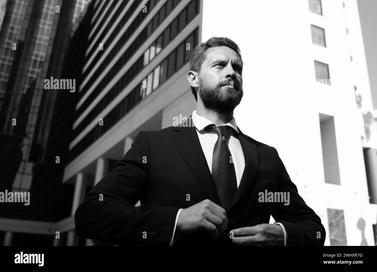 Suiting trend. Businessman wear classic suit. Business formal style. Trendy menswear. Formalwear. Classy wardrobe. Fashion man. Stock Photo