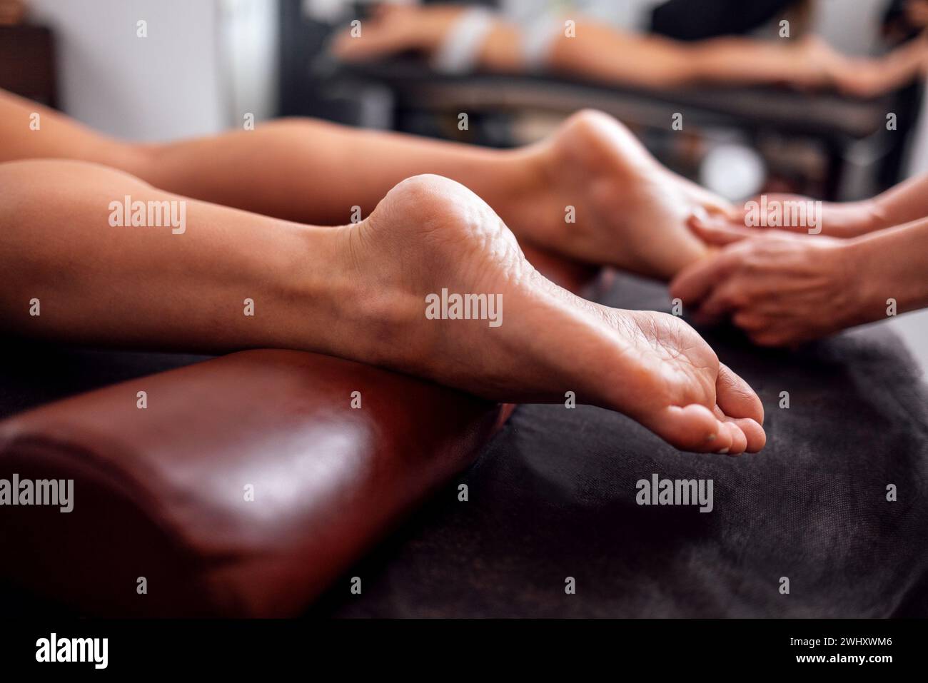 Close up of female foot getting gentle massage Stock Photo