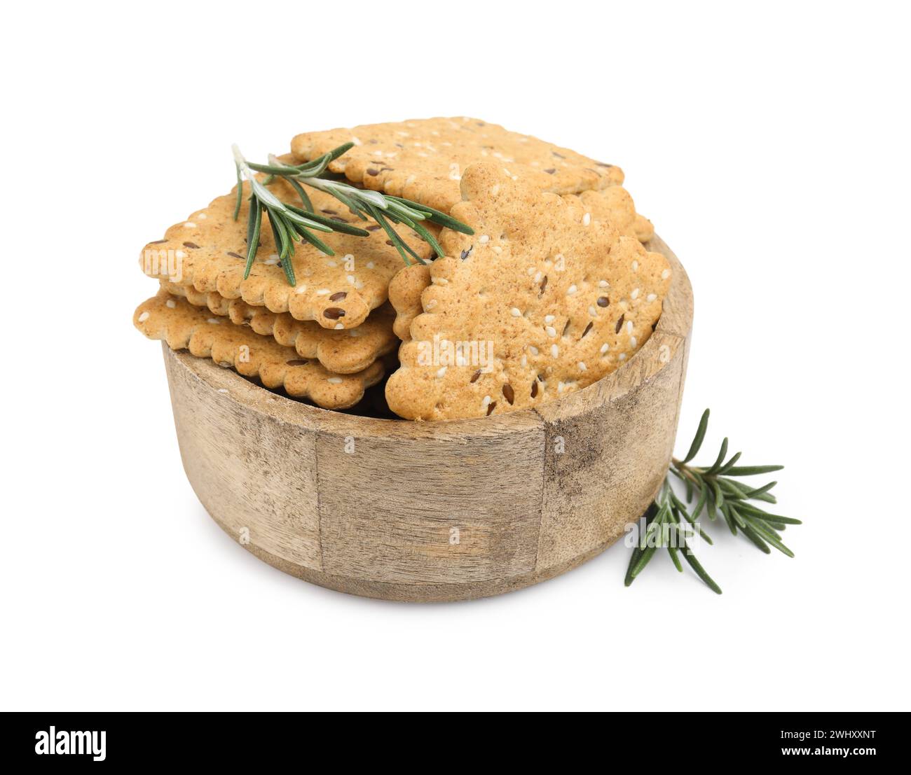 Cereal crackers with flax, sesame seeds and rosemary in bowl isolated ...