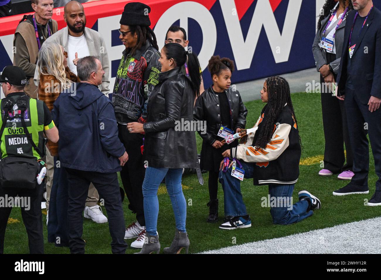 Jay-Z and daughter Blue Ivy and Rumi (Right) attend Super Bowl LVIII