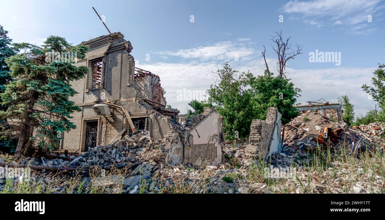 Destroyed and burned houses in the city Russia Ukraine war Stock Photo