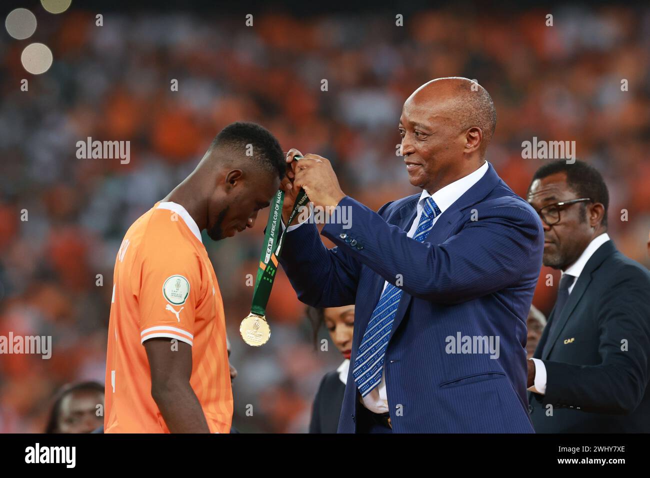 Abidjan, Cote d'Ivoire. 11th Feb, 2024. Patrice Motsepe (R), the president of the Confederation of African Football (CAF), awards players of team Cote d'Ivoire during the awarding ceremony after the final of the Africa Cup of Nations (AFCON) football match between Nigeria and Cote d'Ivoire in Abidjan, Cote d'Ivoire, on Feb. 11, 2024. Credit: Yvan Sonh/Xinhua/Alamy Live News Stock Photo
