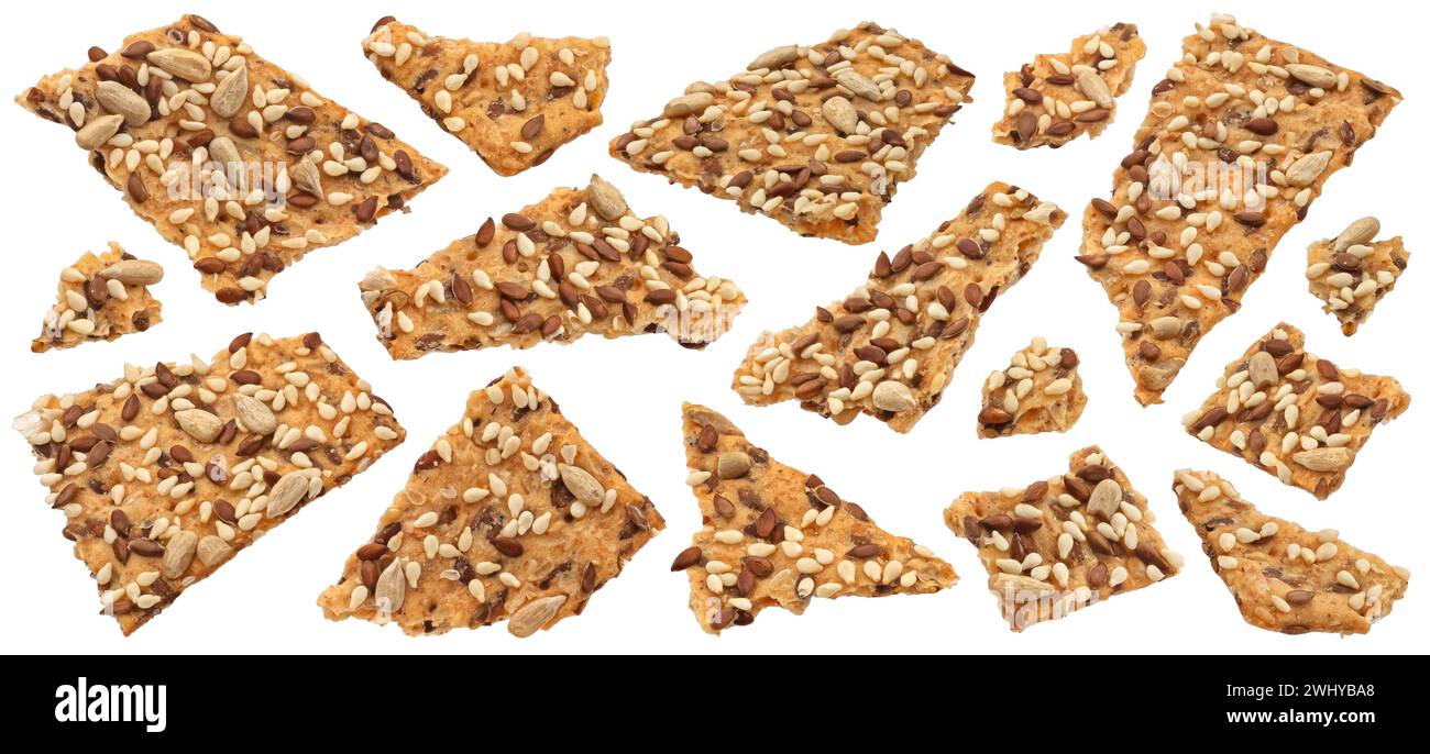 Broken crispbread, whole grain crackers with flax seeds isolated on white background Stock Photo