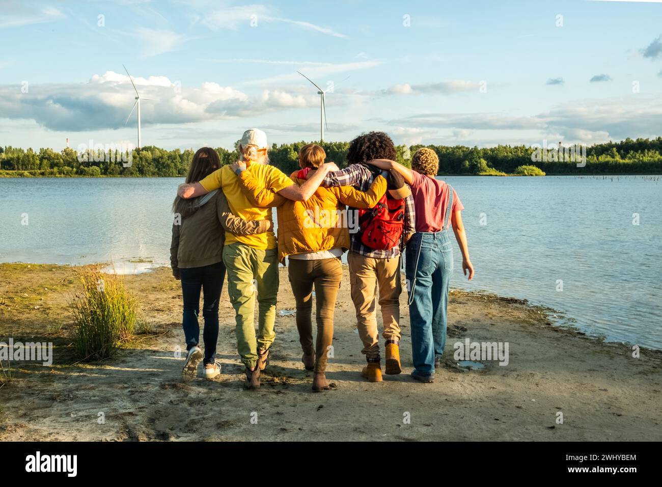 Friends Hugging by Forest Lake Stock Photo