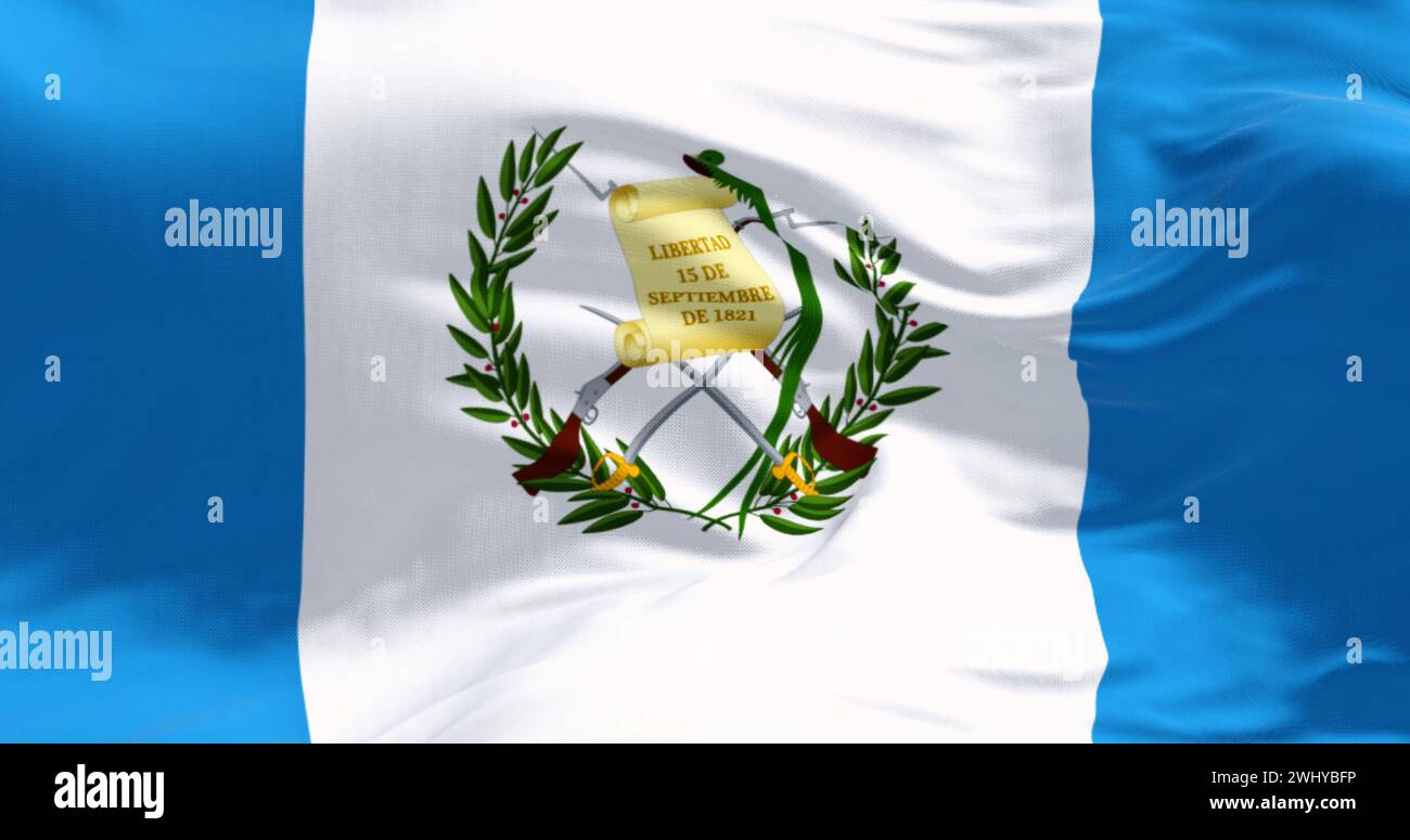 Closeup of Guatemala national flag waving. Three vertical blue and white stripes with a