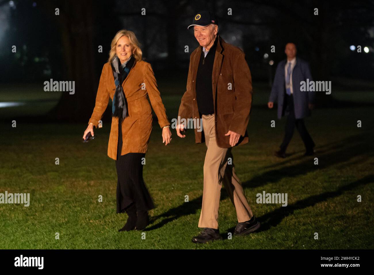 Washington, United States. 11th Feb, 2024. US President Joe Biden and First Lady Jill Biden walk on the South Lawn of the White House after arriving on Marine One in Washington, DC on Sunday, February 11, 2024. Biden urged Prime Minister Benjamin Netanyahu to shield civilians in Gaza from an Israeli military operation in the southern city of Rafah, saying it shouldn't proceed without a 'credible and executable plan' for their safety and support. Photo by Nathan Howard/UPI Credit: UPI/Alamy Live News Stock Photo