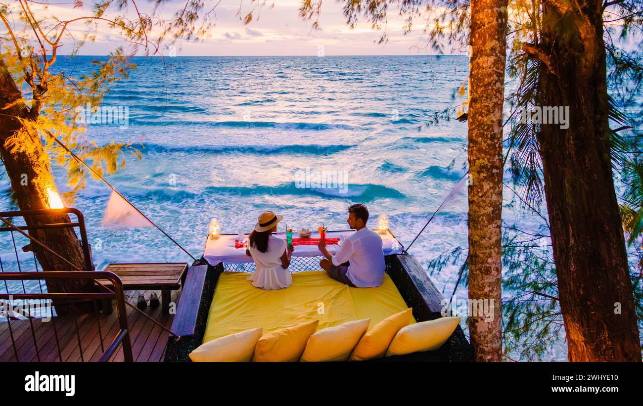 Romantic dinner on the beach in Koh Kood Thailand, couple having dinner on the beach during vacation Stock Photo