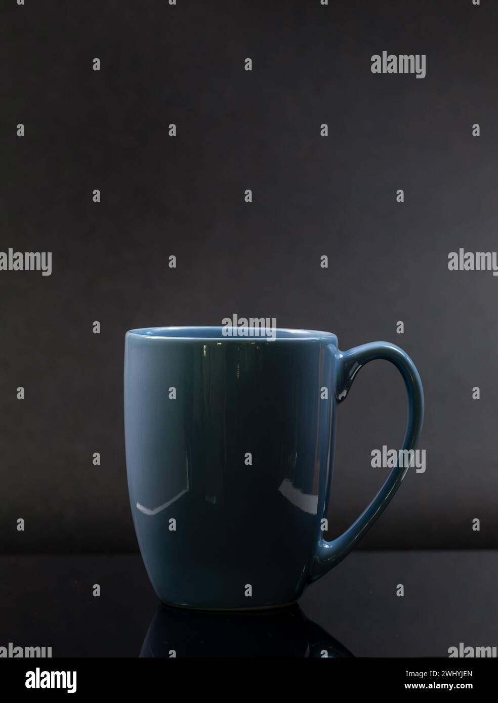 Blue mug isolated on a black background Stock Photo