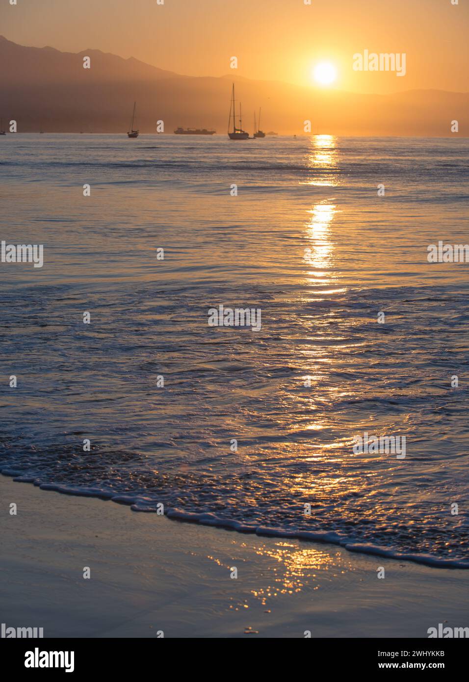 Clear, Orange sunrise, Santa Barbara coast, Stearns Wharf, Coastal view, Morning glow, Sunlight reflection, Coastal beauty Stock Photo