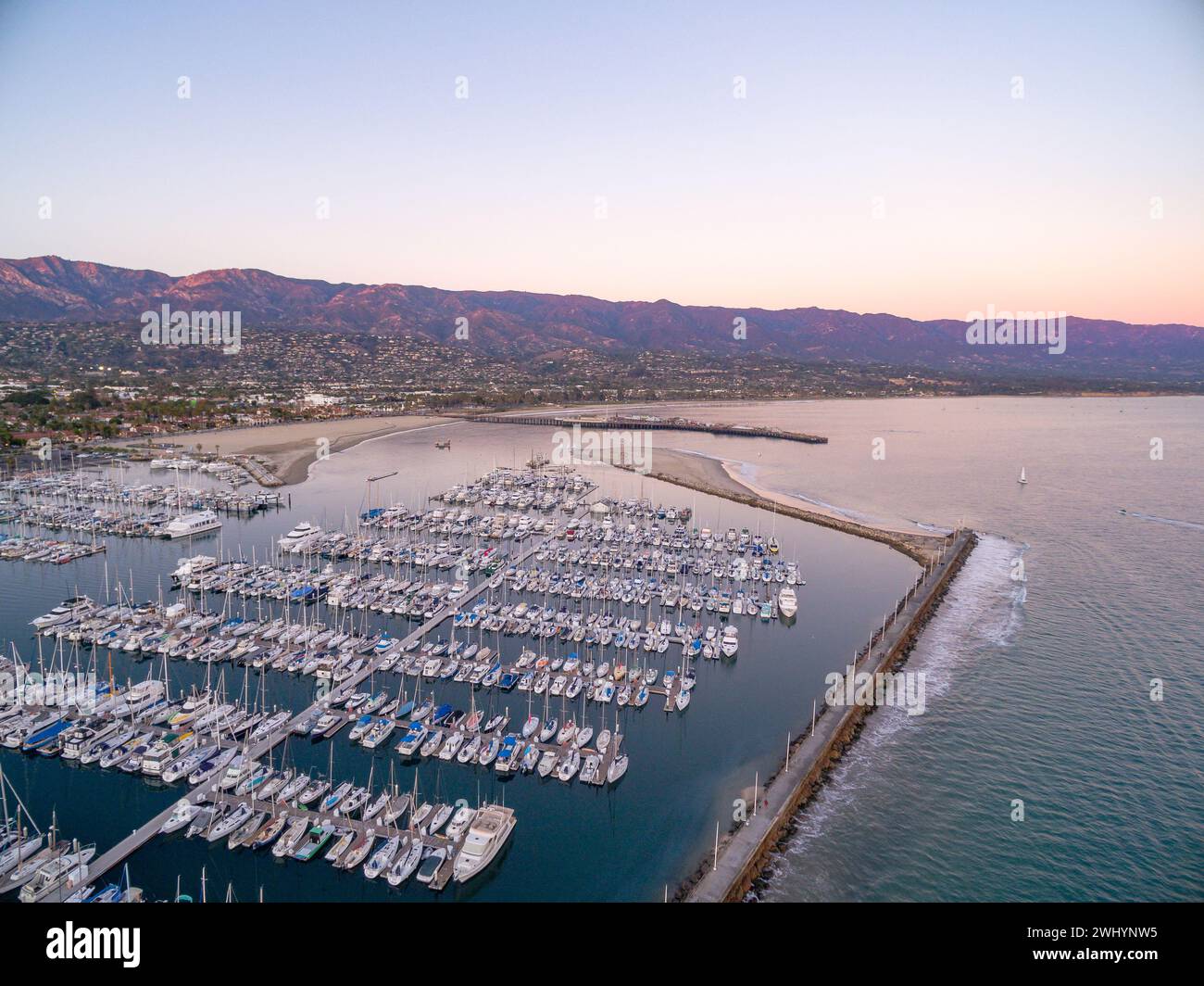 Aerial, Photo, Santa Barbara Harbor, Stearns Wharf, Downtown, Sunset, Brilliant, Purple, Blue, Coastal Cityscape, Aerial View, Waterfront, Pacific Stock Photo