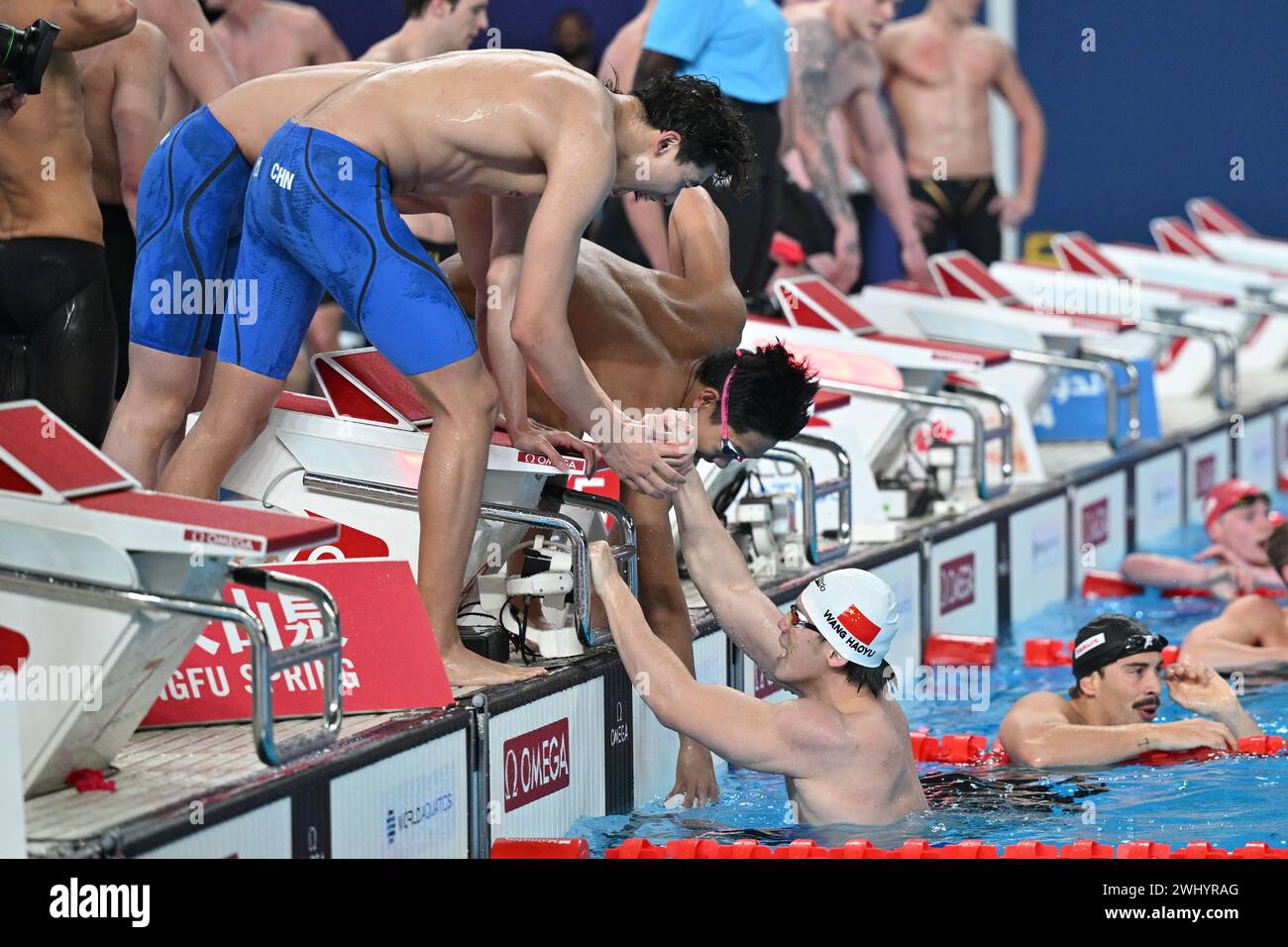 Doha, Qatar. 11th Feb, 2024. Wang Haoyu (bottom) of Team China ...