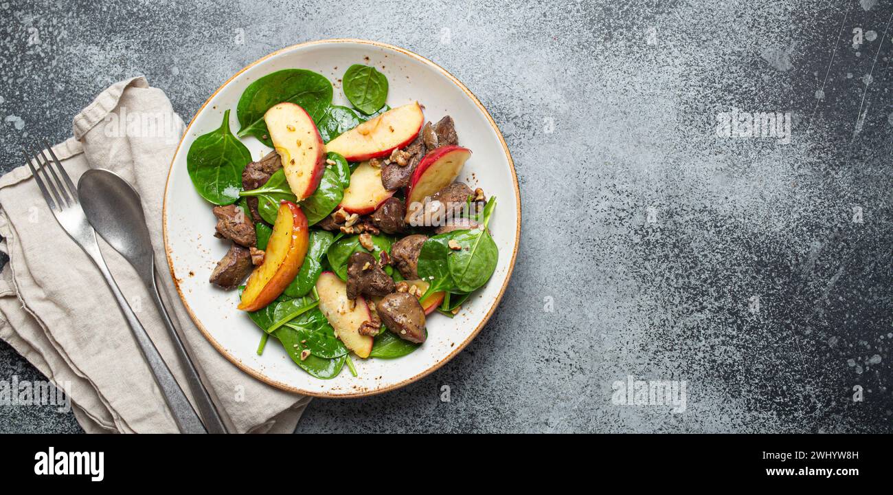 Healthy Salad with Iron Rich Ingredients Chicken Liver, Apples, Fresh Spinach and Walnuts on