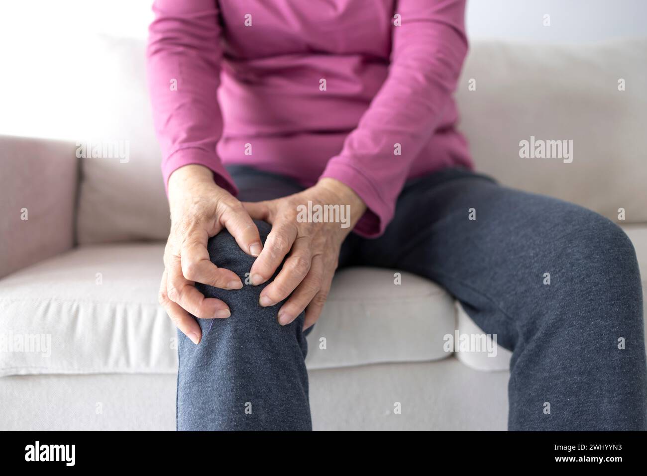 senior woman suffering from knee ache Stock Photo