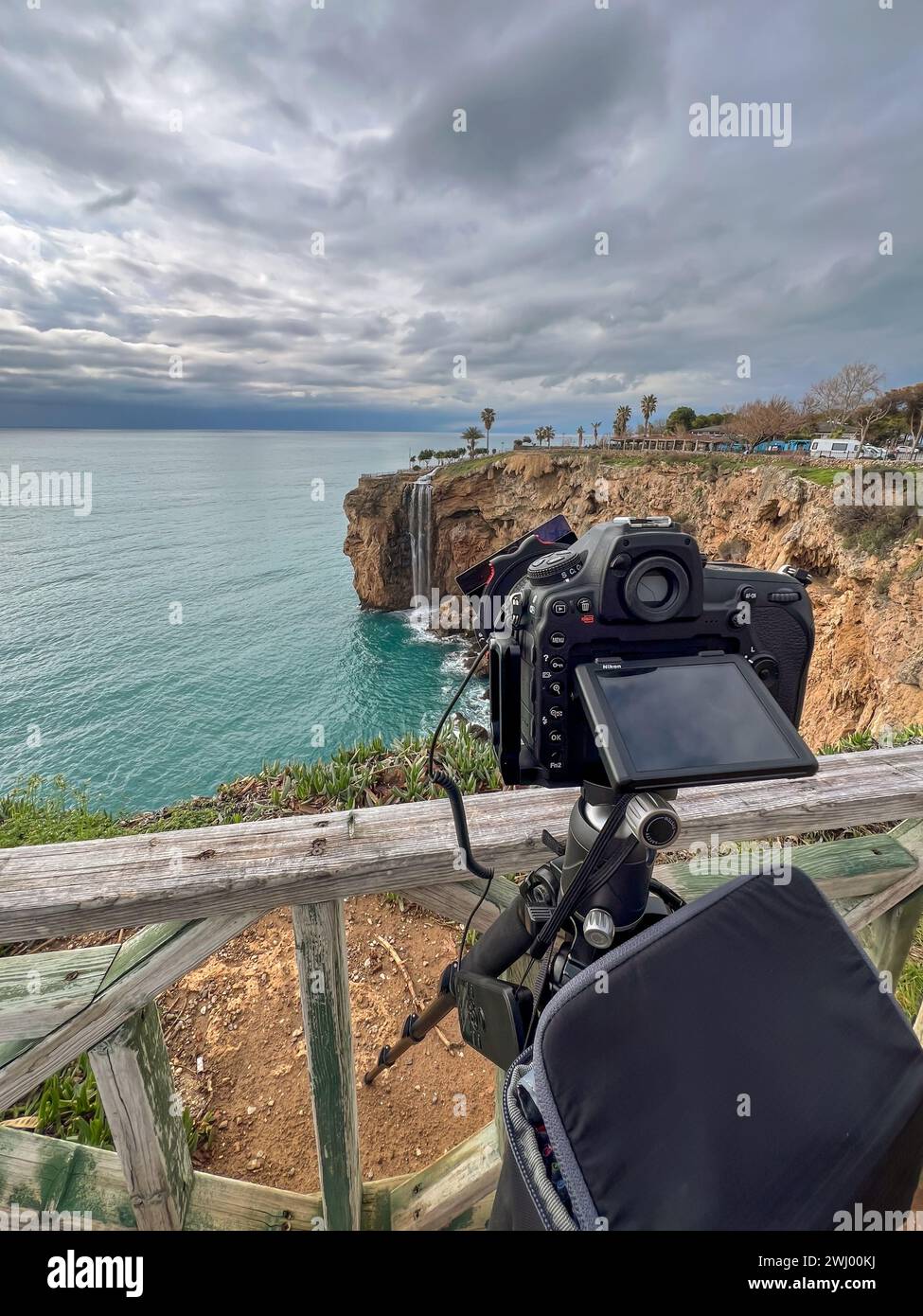 A camera with a circular polarizer and ND filter takes long exposure landscape photos Stock Photo