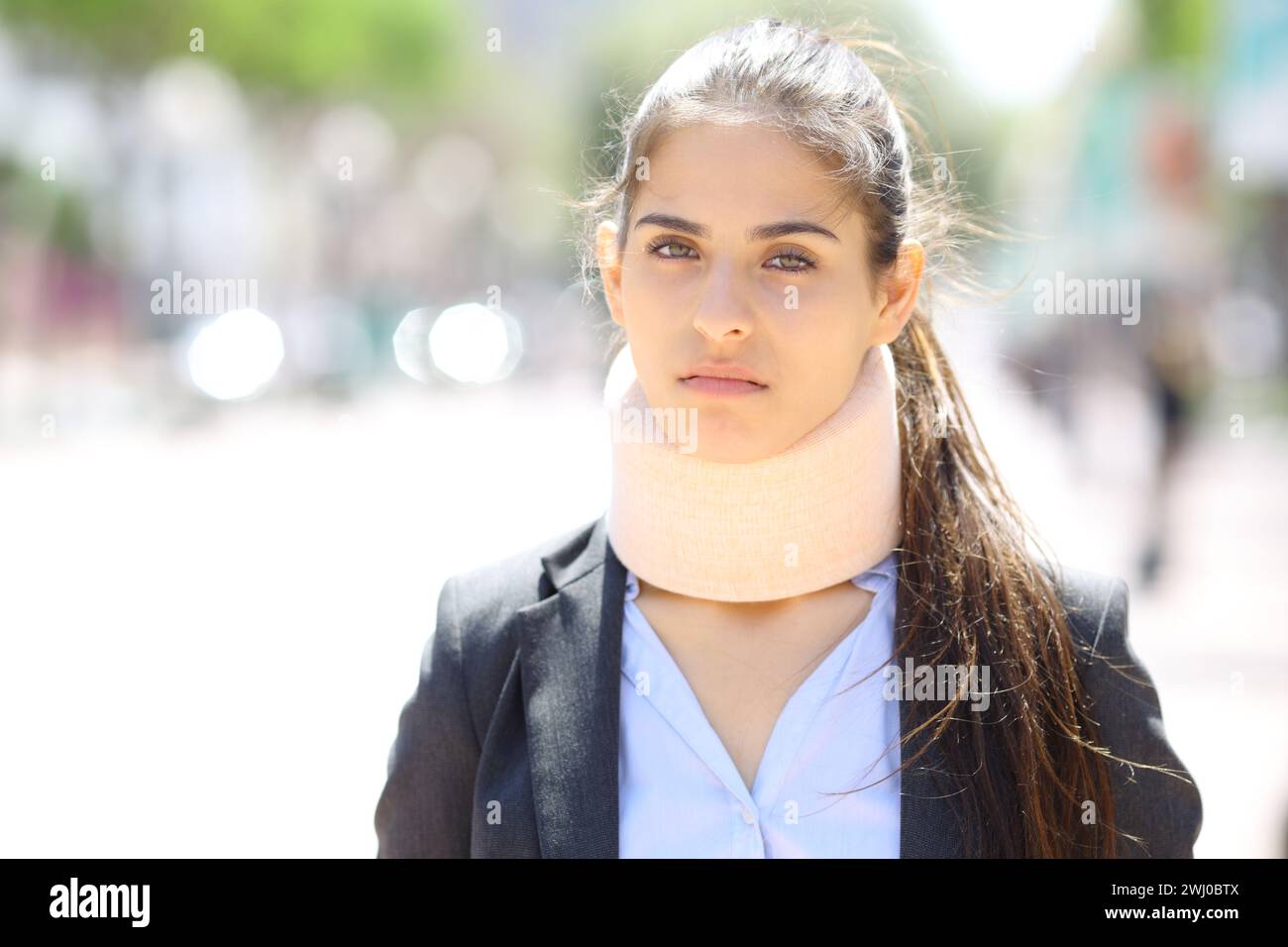 Angry convalescent businesswoman looks at you in the street Stock Photo
