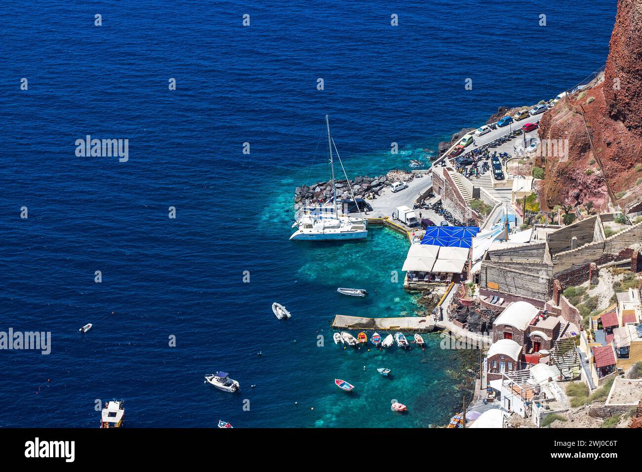 Santorini bay with many tourists Stock Photo