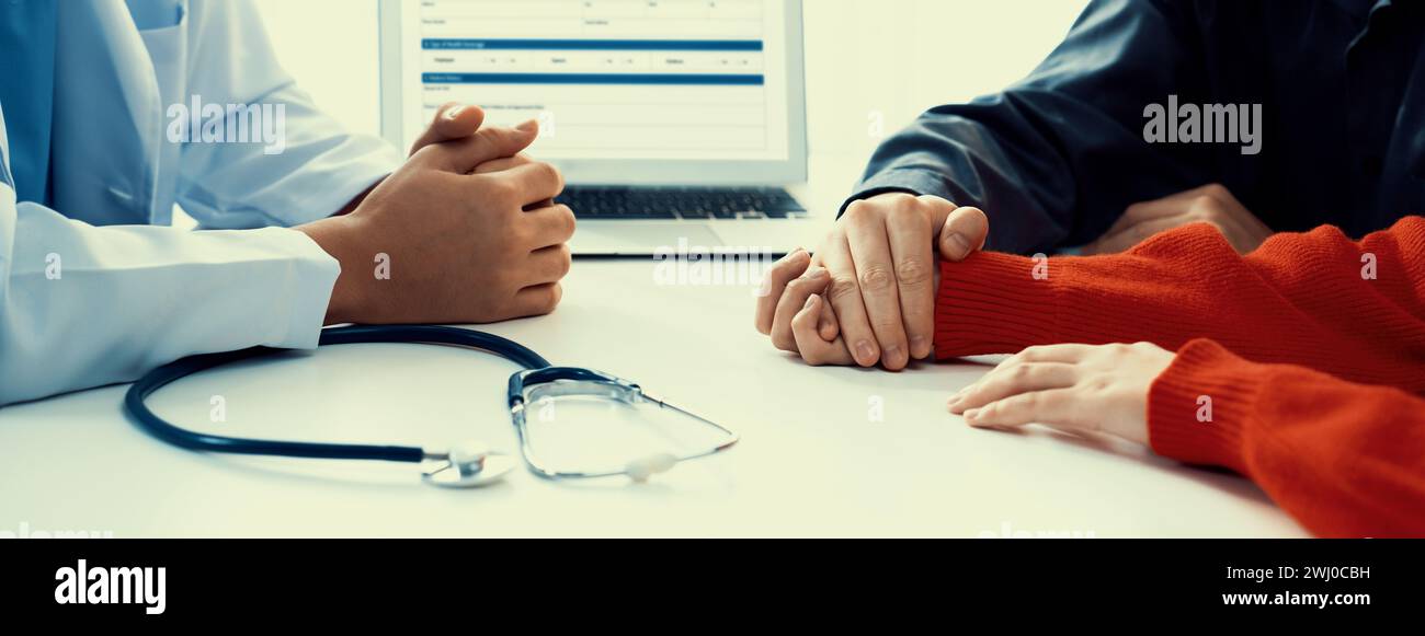 Couple attend fertility or medical consultation with gynecologist at hospital as family planning