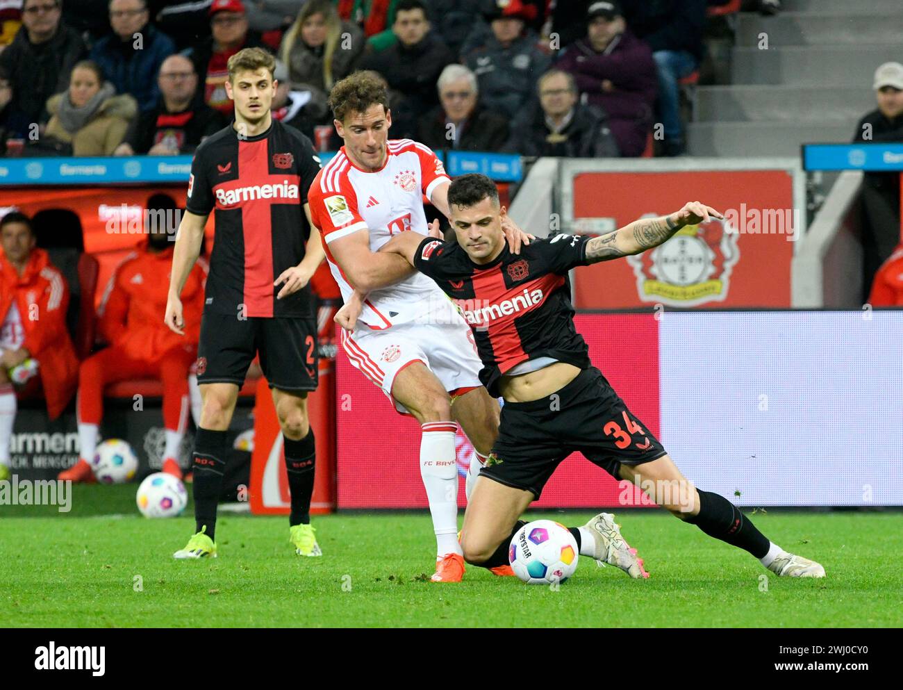 BayArena Leverkusen Germany,  10.2.2024, Football: Bundesliga Season 2023/2024 matchday 21.,  Bayer 04 Leverkusen (B04) vs FC Bayern Muenchen (FCB) — from left: Josip Stanisic (B04), Leon Goretzka (FCB), Granit Xhaka (B04) Stock Photo