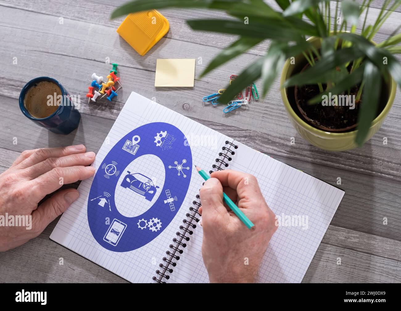 Driverless car concept drawn on a notepad placed on a desk Stock Photo