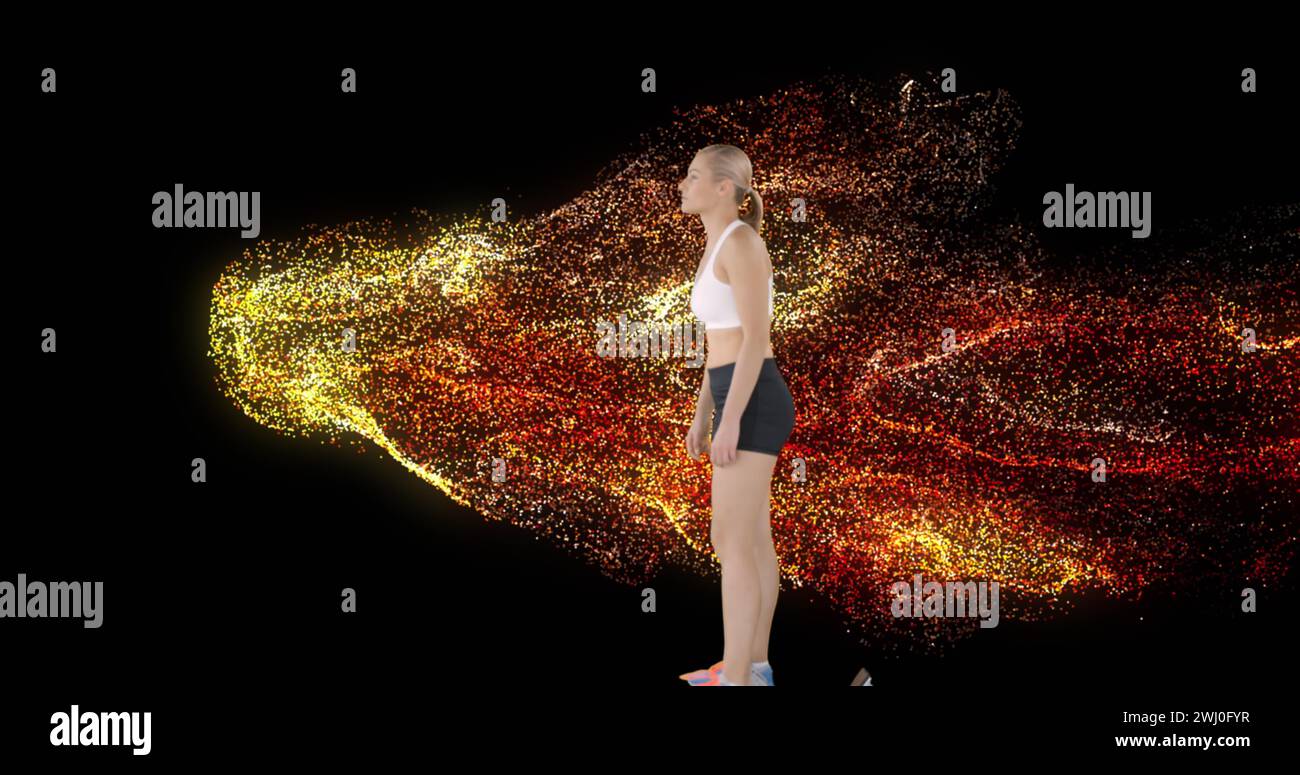 Image of glowing red particles and female runner getting onto starting blocks Stock Photo