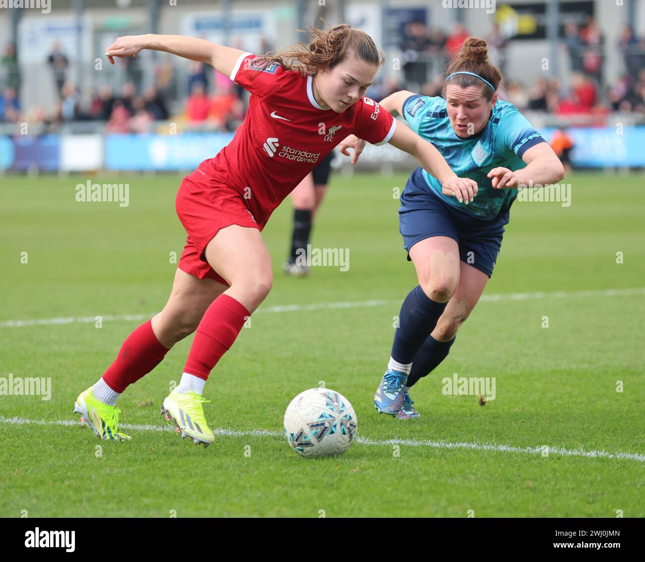 Lucy Parry of Liverpool Women takes on Emma Mukandi of London City Lionesses during The Women's FA Cup Fifth Round soccer match between London City Li Stock Photo