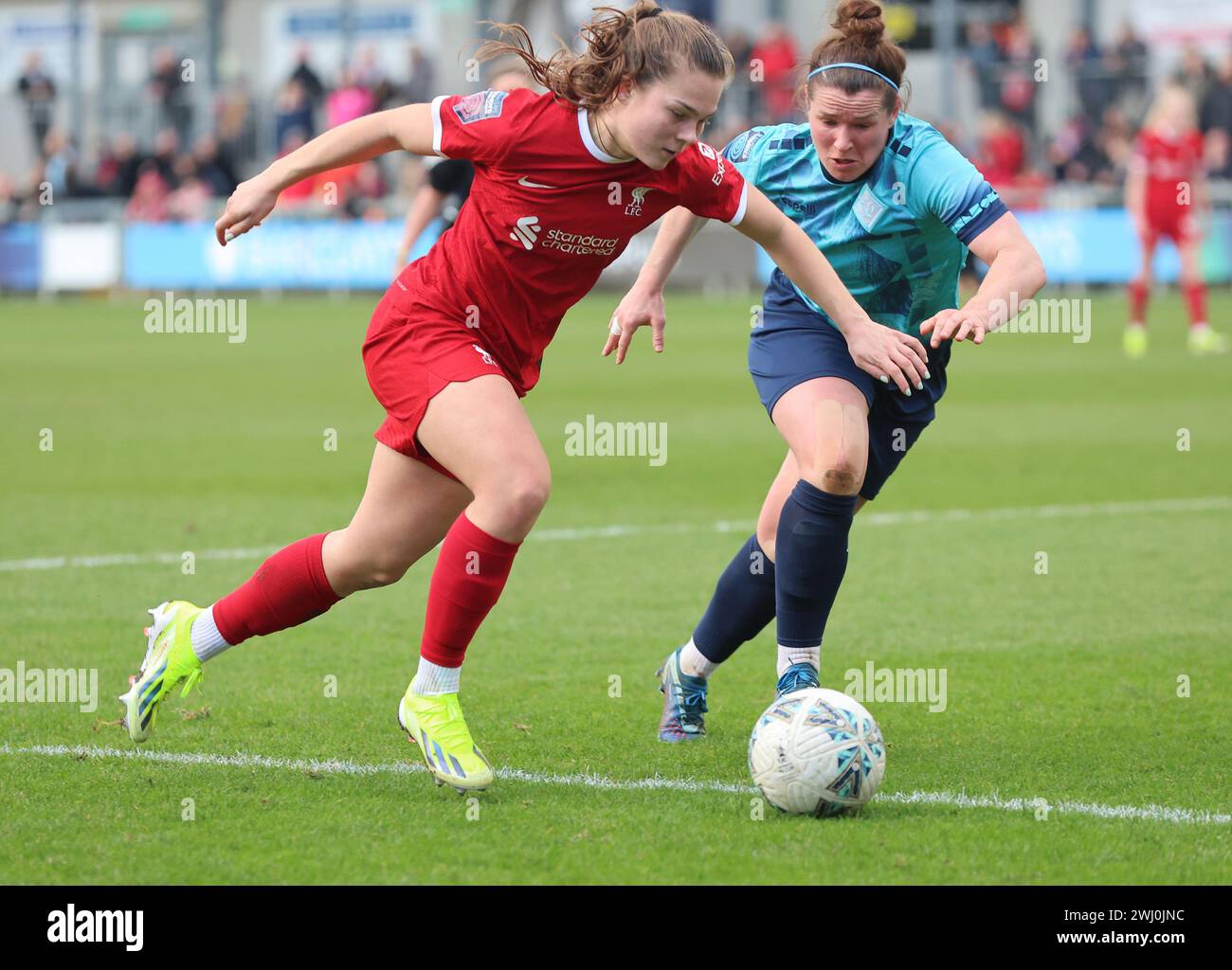 Lucy Parry of Liverpool Women takes on Emma Mukandi of London City Lionesses during The Women's FA Cup Fifth Round soccer match between London City Li Stock Photo