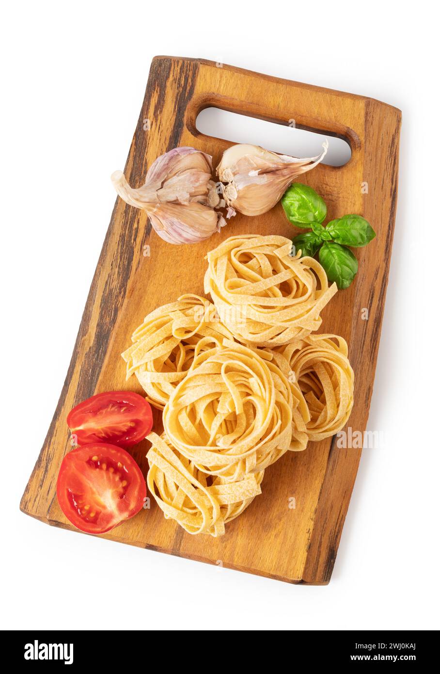 Pasta tagliatelle on a cutting board Stock Photo