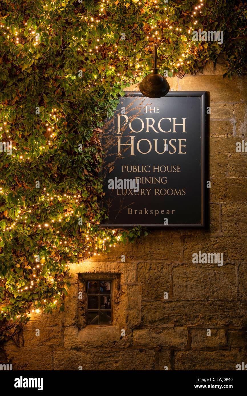 Yellow fairy lights outside The Porch house Inn at night. Stow on the Wold, Gloucestershire, Cotswolds, England Stock Photo
