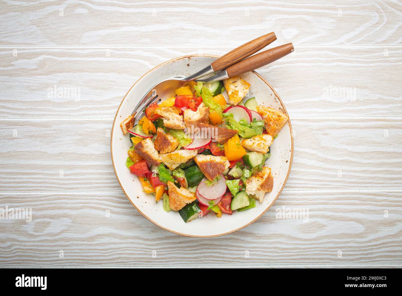 Traditional Levant dish Fattoush salad, Arab cuisine, with pita bread croutons, vegetables