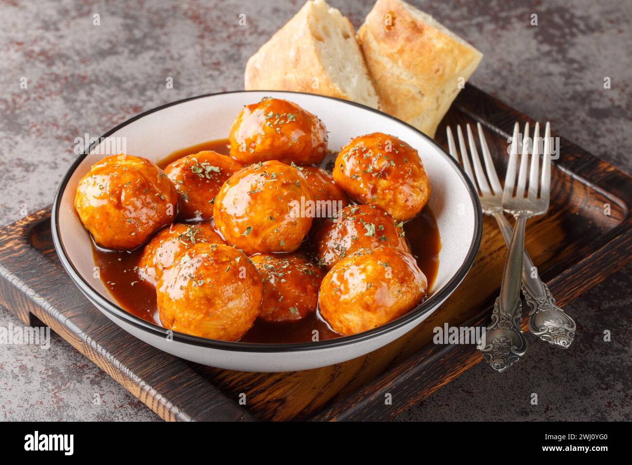 Chicken Meatballs with Chipotle Honey Sauce closeup on the bowl on the table. Horizontal Stock Photo