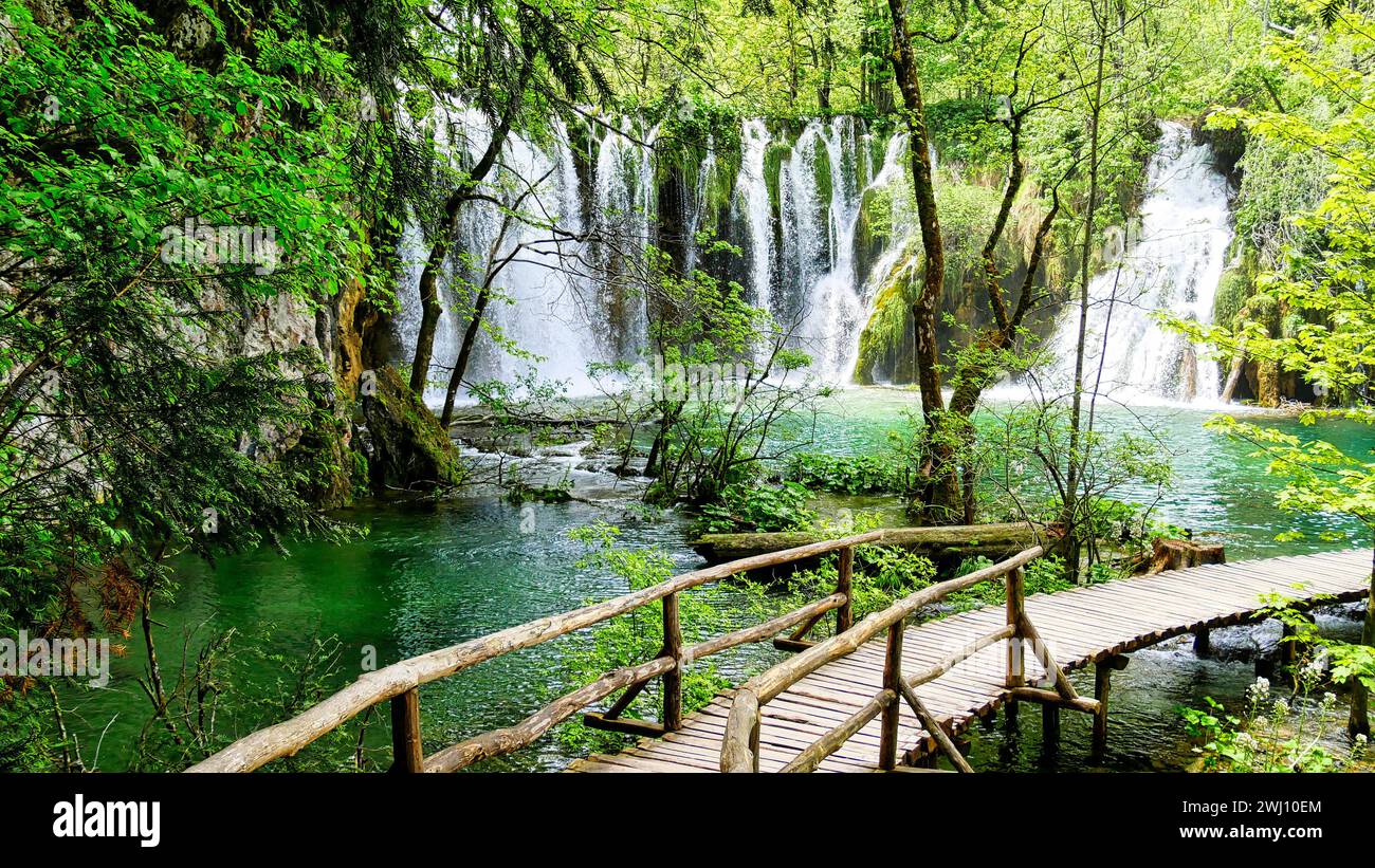 Boardwalk circular path with bridge in front of waterfall in Plitvice Lakes National Park Stock Photo