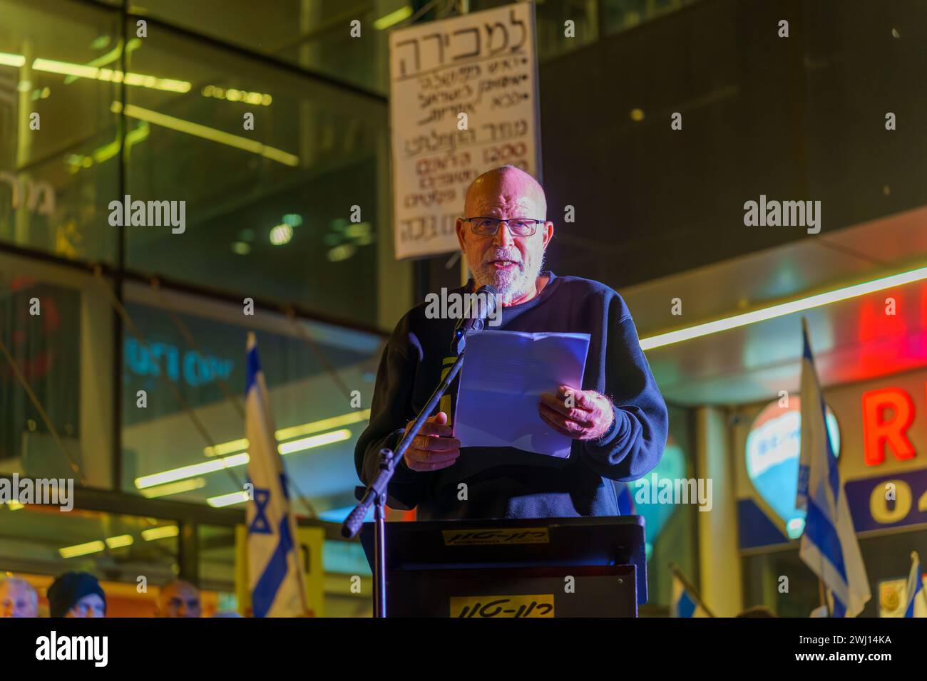 Haifa, Israel - February 10, 2024: Col. (ret) Rami Matan speaks to the crowd, part of a protest march against the government, Haifa, Israel Stock Photo