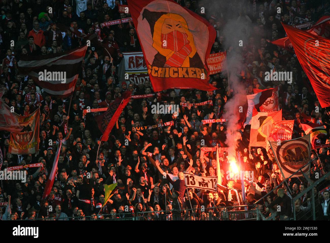 BayArena Leverkusen Germany,  10.2.2024, Football: Bundesliga Season 2023/2024 matchday 21.,  Bayer 04 Leverkusen (B04) vs FC Bayern Muenchen (FCB) — fans of Munich ultra group Schickeria light flares Stock Photo