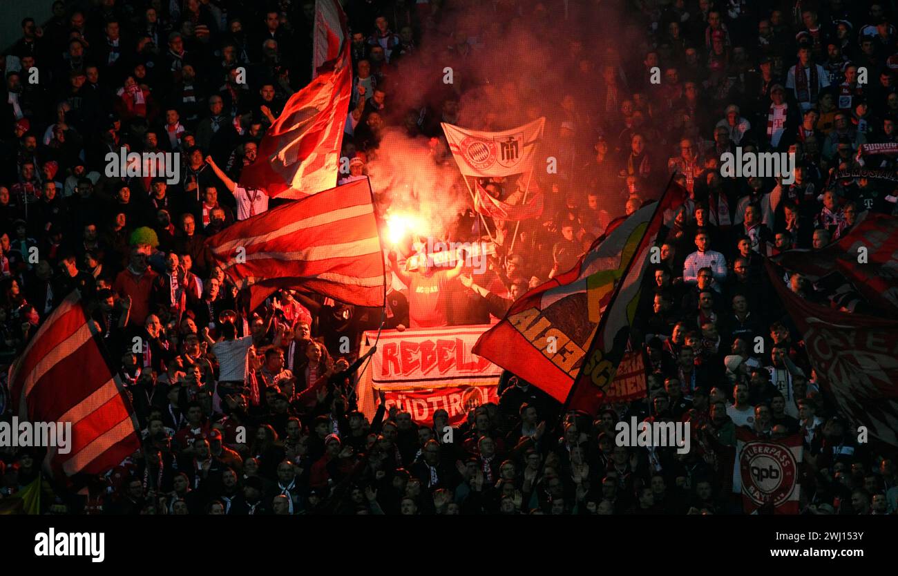 BayArena Leverkusen Germany,  10.2.2024, Football: Bundesliga Season 2023/2024 matchday 21.,  Bayer 04 Leverkusen (B04) vs FC Bayern Muenchen (FCB) — fans of Munich ultra group Schickeria light flares Stock Photo