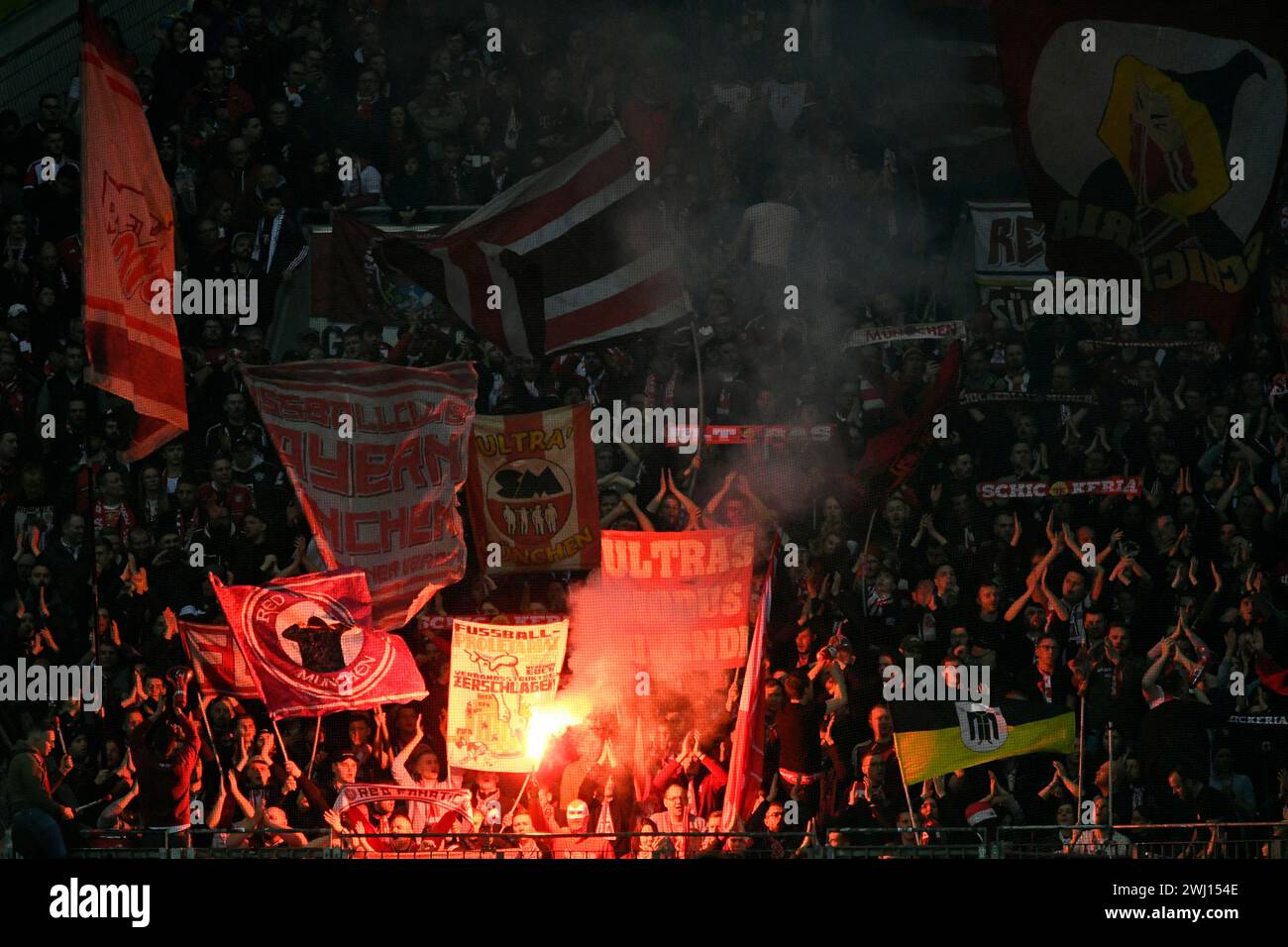 BayArena Leverkusen Germany,  10.2.2024, Football: Bundesliga Season 2023/2024 matchday 21.,  Bayer 04 Leverkusen (B04) vs FC Bayern Muenchen (FCB) — fans of Munich ultra group Schickeria light flares Stock Photo