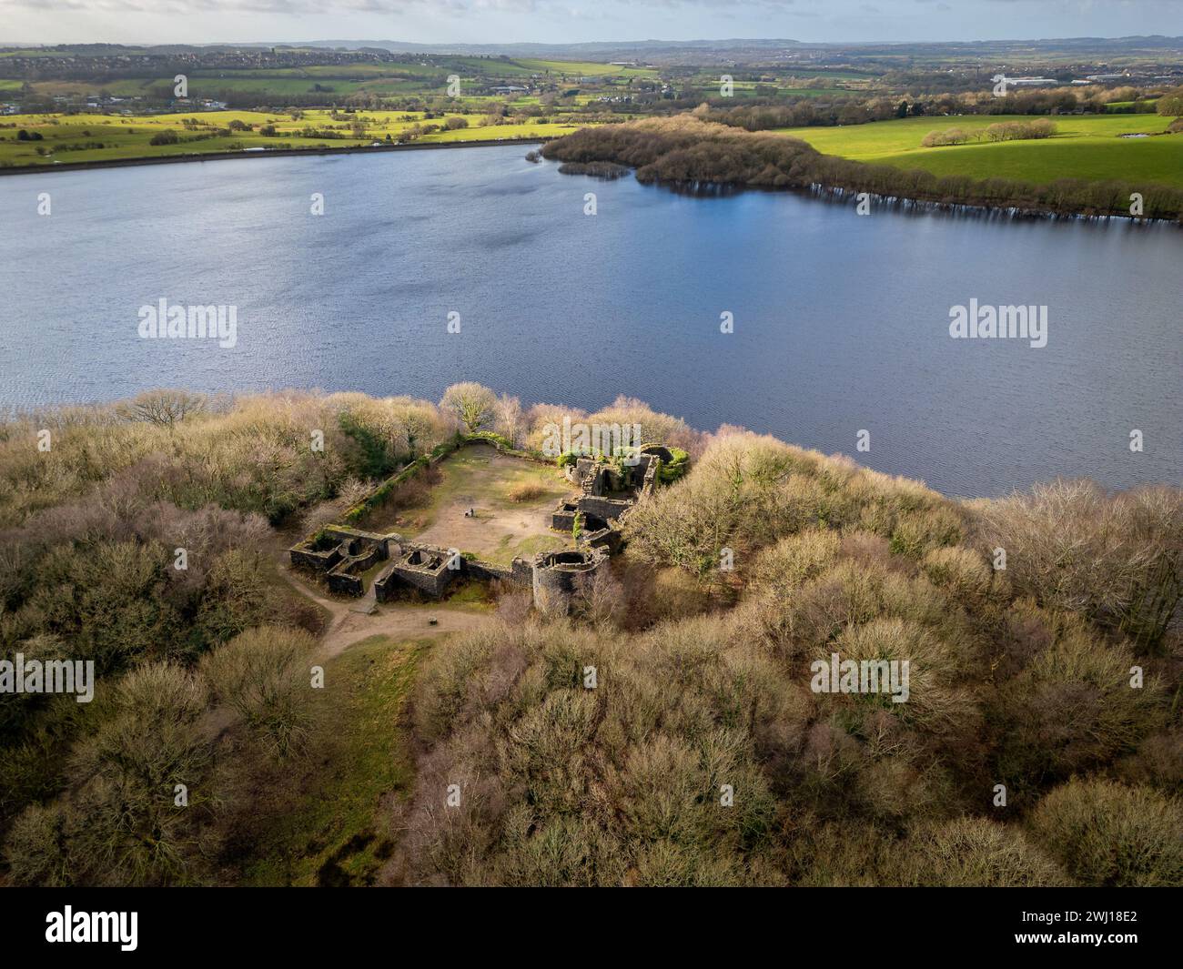 Bolton, England, UK, Monday February 12, 2024. Drone images of early spring sunshine illuminating Liverpool Caste on the shores of Rivington Reservoir, Horwich, Bolton. The castle was commisioned in 1912 by William Hesketh Lever, a philanthropist and founder of Lever Brothers, now UniLever. It was a folly and never intended to be completed and is based on the original on the shores of the Mersey in Liverpool. Credit: Paul Heyes/Alamy News Live. Stock Photo