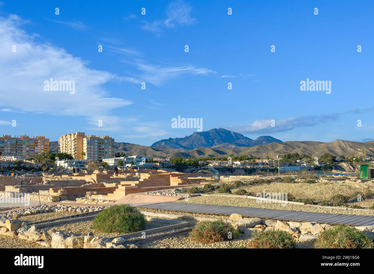 Mountain scenery and city buildings are framed by the La Illeta archeological site. Stock Photo