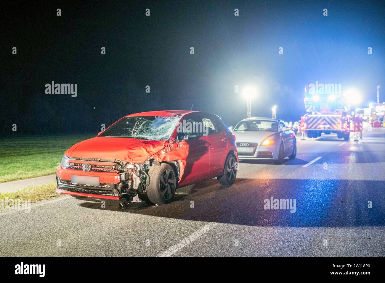 Weilerswist, Germany. 12th Feb, 2024. A badly damaged car stands on a country road after colliding with two people. On their way home from a carnival party, two young men were hit and fatally injured by a car in Weilerswist near Cologne. The two men, aged 20 and 18, were walking along an unlit country road late on Sunday evening, police said. (to dpa 'Two carnival participants die in traffic accident') Credit: Vincent Kempf/dpa/Alamy Live News Stock Photo
