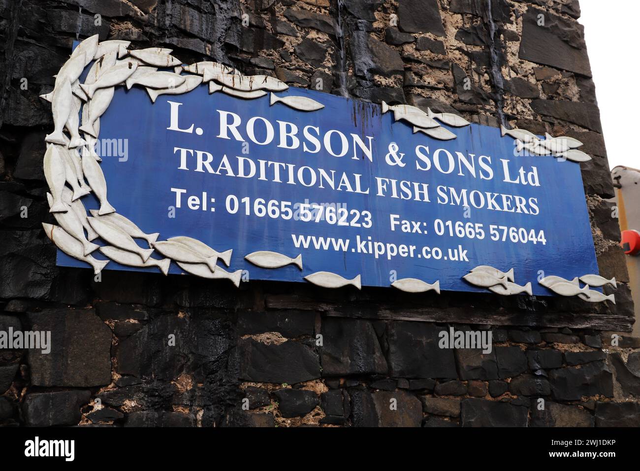 Sign outside Craster Fish Smoking firm, L. Robson & Sons Ltd, Craster, Northumberland Stock Photo