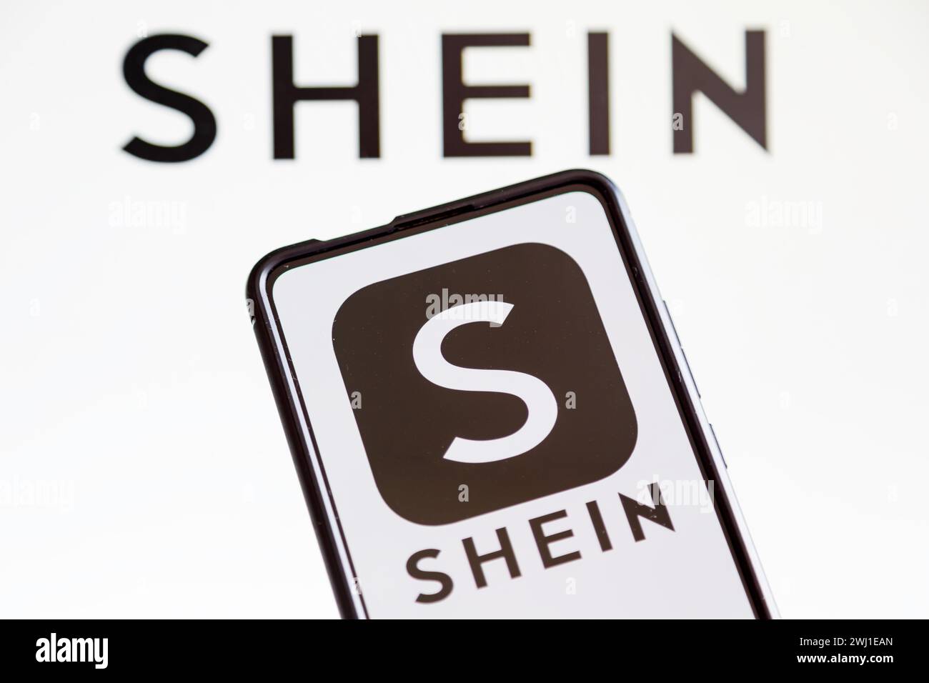 Shein logo online marketplace online commerce ecommerce on a mobile and computer screen Stock Photo