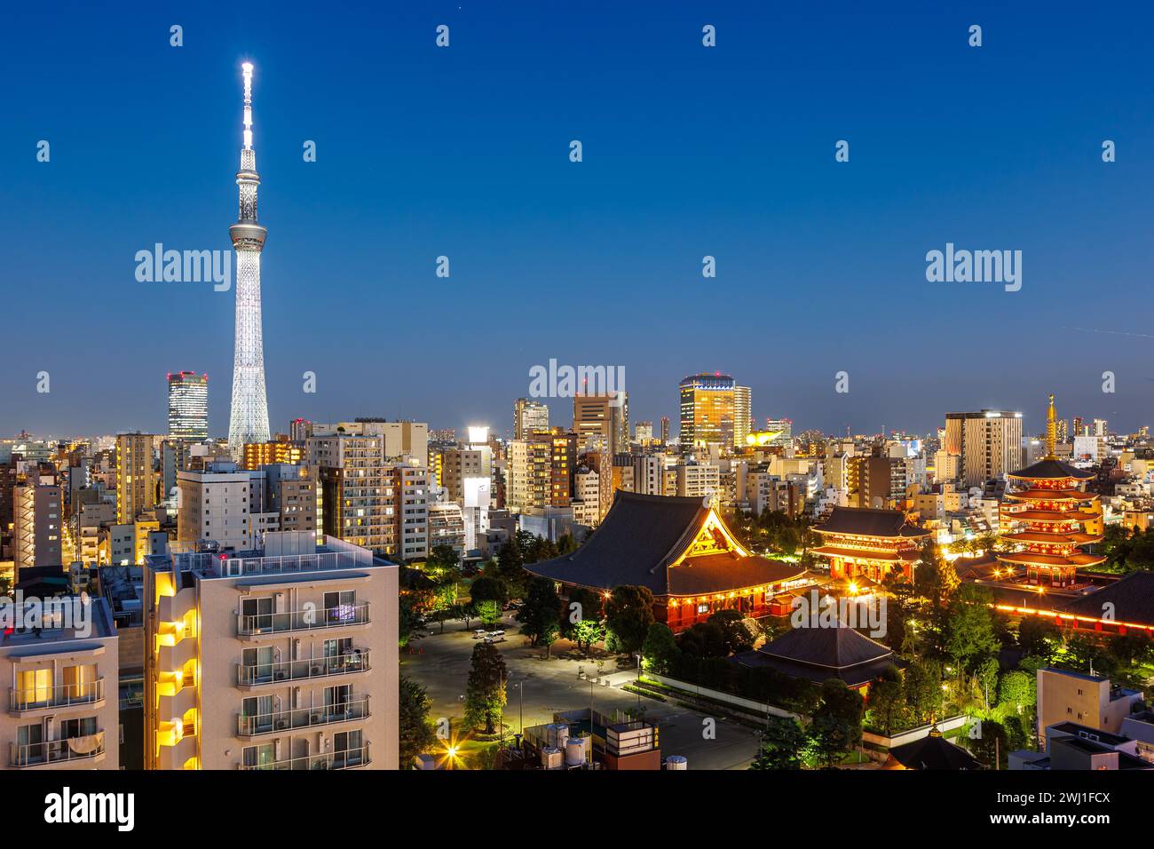 Tokyo SkyTree tower and Asakusa Shrine with the skyline skyscrapers at night in Tokyo, Japan Stock Photo