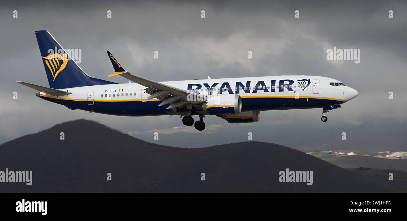 Tenerife, Spain February 11 st, 2024. Boeing 737 MAX 8-200 Ryanair Airlines flies in the dark clouds. Landing at Tenerife Airport Stock Photo