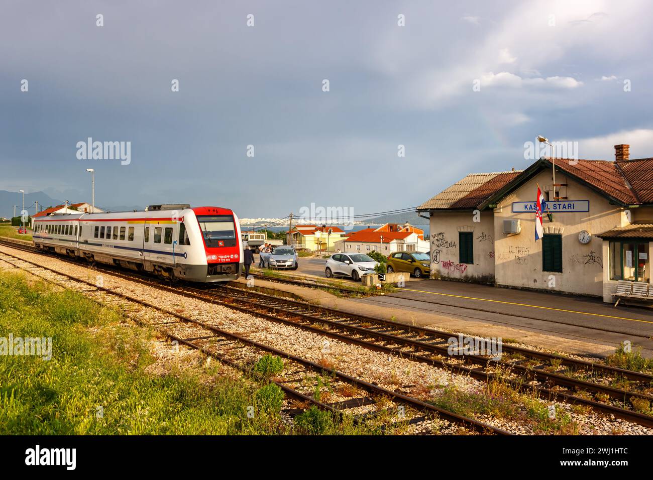 Local train with tilting technology of the Croatian railroad Hrvatske Zeljeznice at KaÅ¡tel Stari station, Croatia Stock Photo