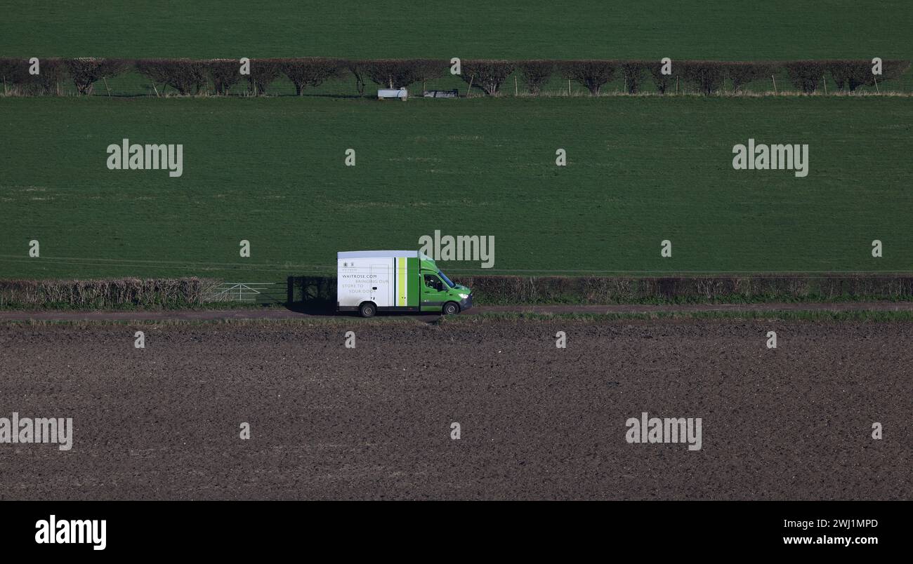 A Waitrose Supermarket home delivery van delivering goods in the countryside. Stock Photo
