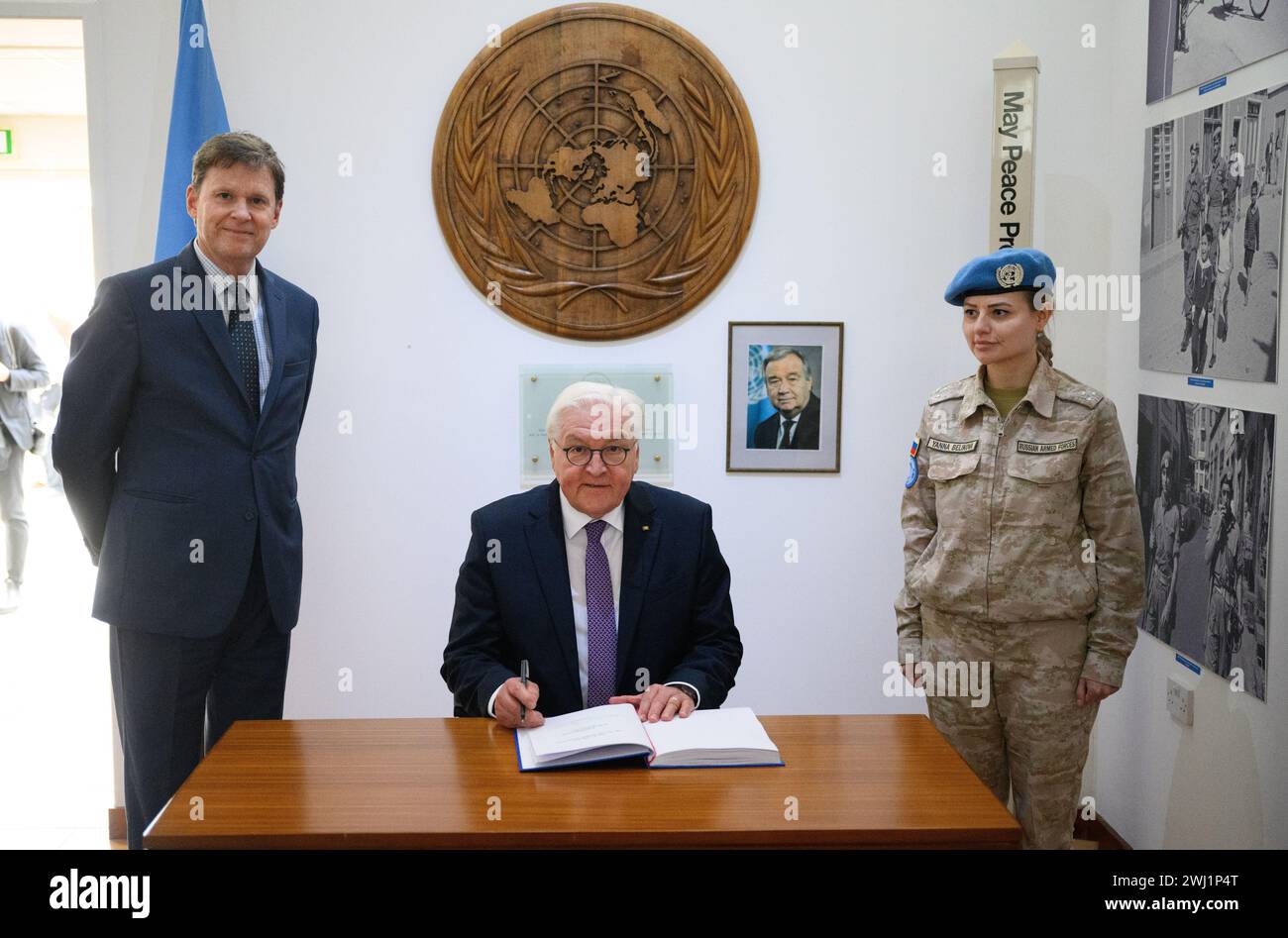 12 February 2024, Cyprus, Nikosia: German President Frank-Walter Steinmeier signs the guest book in the presence of Colin Stewart (l), UN Special Representative and Head of the United Nations Peacekeeping Force in Cyprus (UNFICYP), at the headquarters of the United Nations (UN) peacekeeping missions in Cyprus. There are two UN peacekeeping missions in Cyprus, which are intended to support the comprehensive settlement of the Cyprus problem. Federal President Steinmeier is the first German President to visit the country in the eastern Mediterranean, 20 years after the country's accession to the Stock Photo